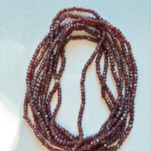 String of tiny faceted genuine garnet beads